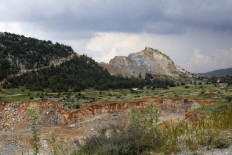 Hunger for concrete eats away at mountains