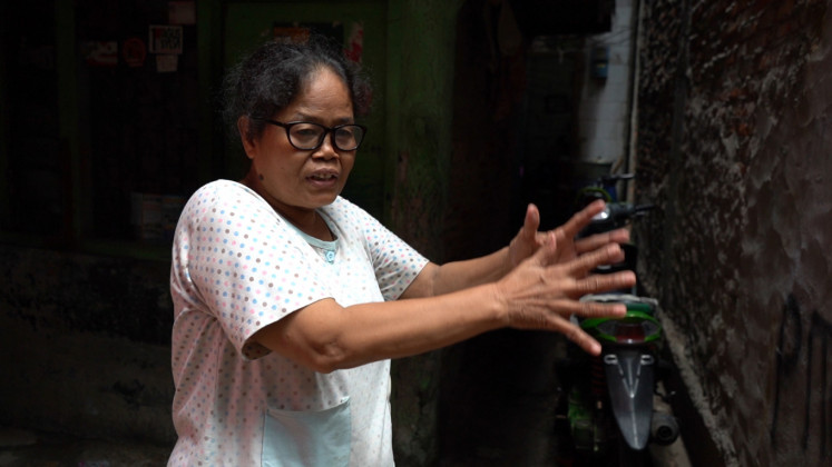 Ani Rubianti, 53, a resident of Muara Baru, North Jakarta, says in 2013 a severe tidal flood swallowed her neighborhood. 