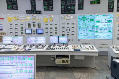 A stock photo of the central control room of a nuclear power plant