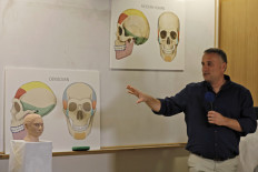 Israeli professor Liran Carmel of the Hebrew University speaks to the press as he reveals a 3D printed model of the face of prehistoric human species Denisovan following a research using DNA methylation data, during a press conference at the Hebrew University in Jerusalem on Sept. 19, 2019.
