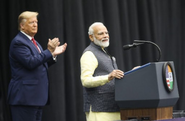 US President Donald Trump listens to Indian Prime Minister Narendra Modi at the Community Summit on September 22, 2019 at NRG Stadium in Houston, Texas. Donald Trump and Narendra Modi both rose to power on nationalist appeals to their countries' majority communities. Both scoff at traditional media and enjoy making pronouncements by Twitter. And now, the two leaders will bond over an extravaganza of Indian culture as they visibly symbolize their alliance. The US president will join the Indian prime minister on Sunday at a football stadium in Houston where community representatives say they expect 50,000 Indian-Americans for performances followed by the leaders' remarks.

