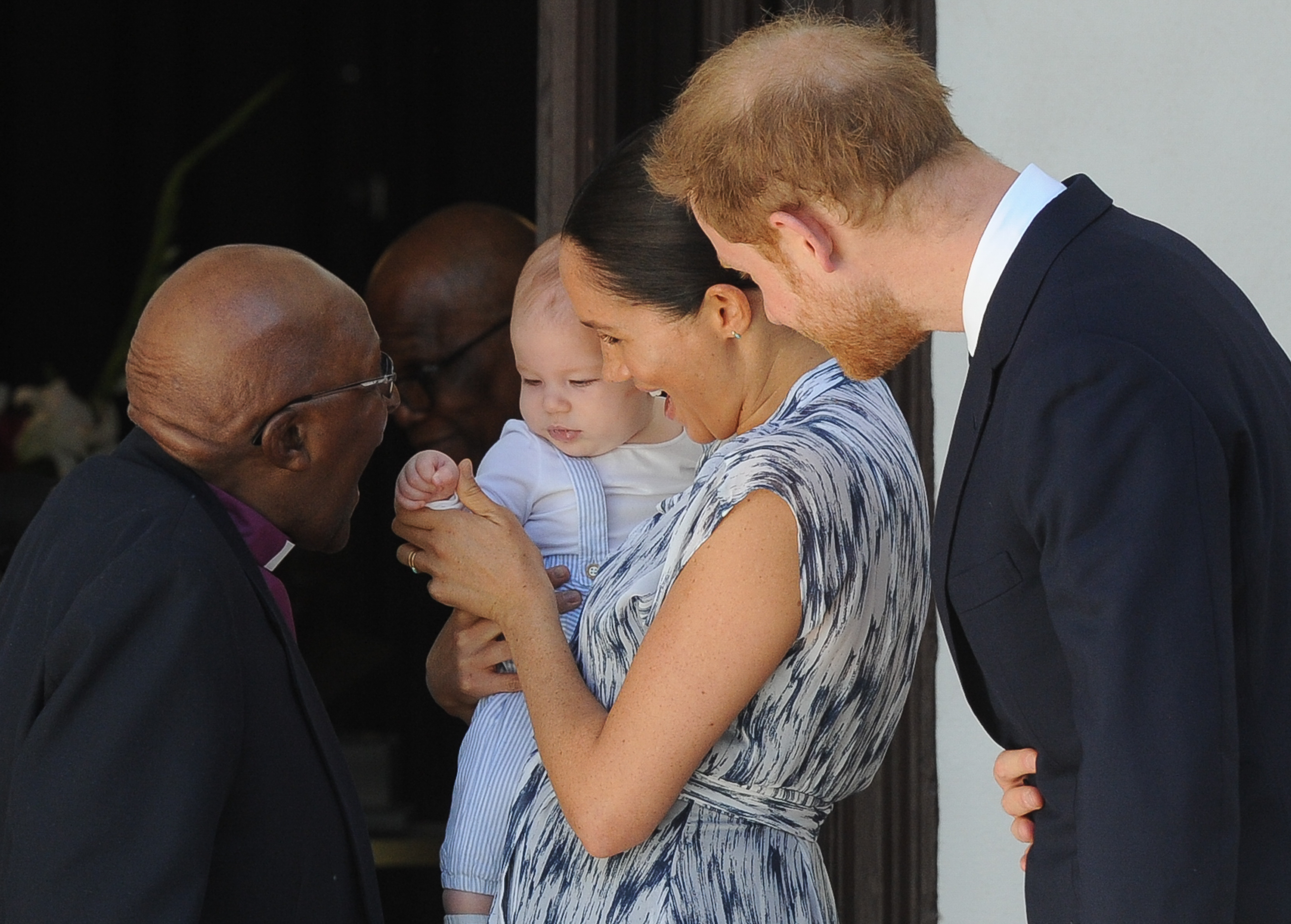 Britain's Duke and Duchess of Sussex, Prince Harry and his wife Meghan hold their baby son Archie as they meet with Archbishop Desmond Tutu and his wife Leah at the Tutu Legacy Foundation in Cape Town on September 25, 2019.