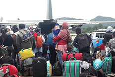 Regions help residents flee Papua following deadly riot