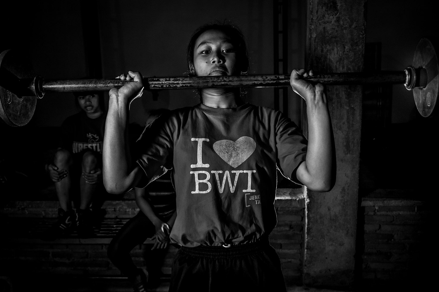 Reni Farida, 15, a young wrestler from Banyuwangi, lifts weights at the camp. JP/Aman Rochman