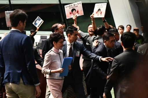 Hong Kong assembly in chaos; attack on democracy leader a 'chilling signal'