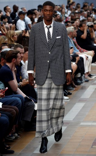 A model presents a creation by US designer Thom Browne, during the Men's Fashion Week for the Spring and Summer 2018 collection in Paris, on June 25, 2017.