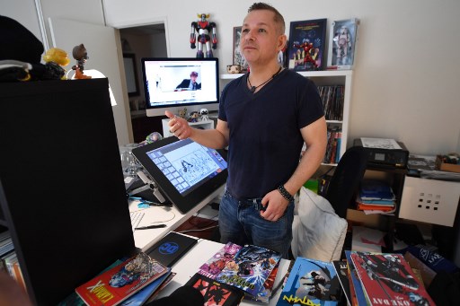 French comic book illustrator Phil Briones works in his home office in Los Angeles, California, on September 18, 2019. 