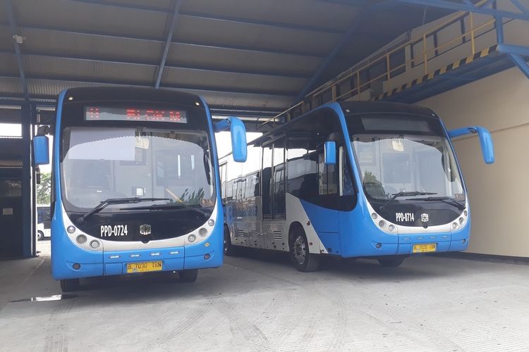 Buses by Chinese manufacturer Zhongtong are parked in a row on Oct. 16, 2019 at the bus depot of state-run bus company Jakarta Passenger Transportation (PPD) in Klender, East Jakarta. 