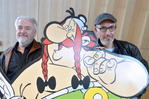 Author Jean-Yves Ferri and illustrator Didier Conrad pose with a figure of the character Adrenaline and their new Asterix comic album 'La Fille De Vercingetorix' (Asterix and the Chieftain's daughter) during an interview in Vanves near Paris, France, on October 22, 2019. 