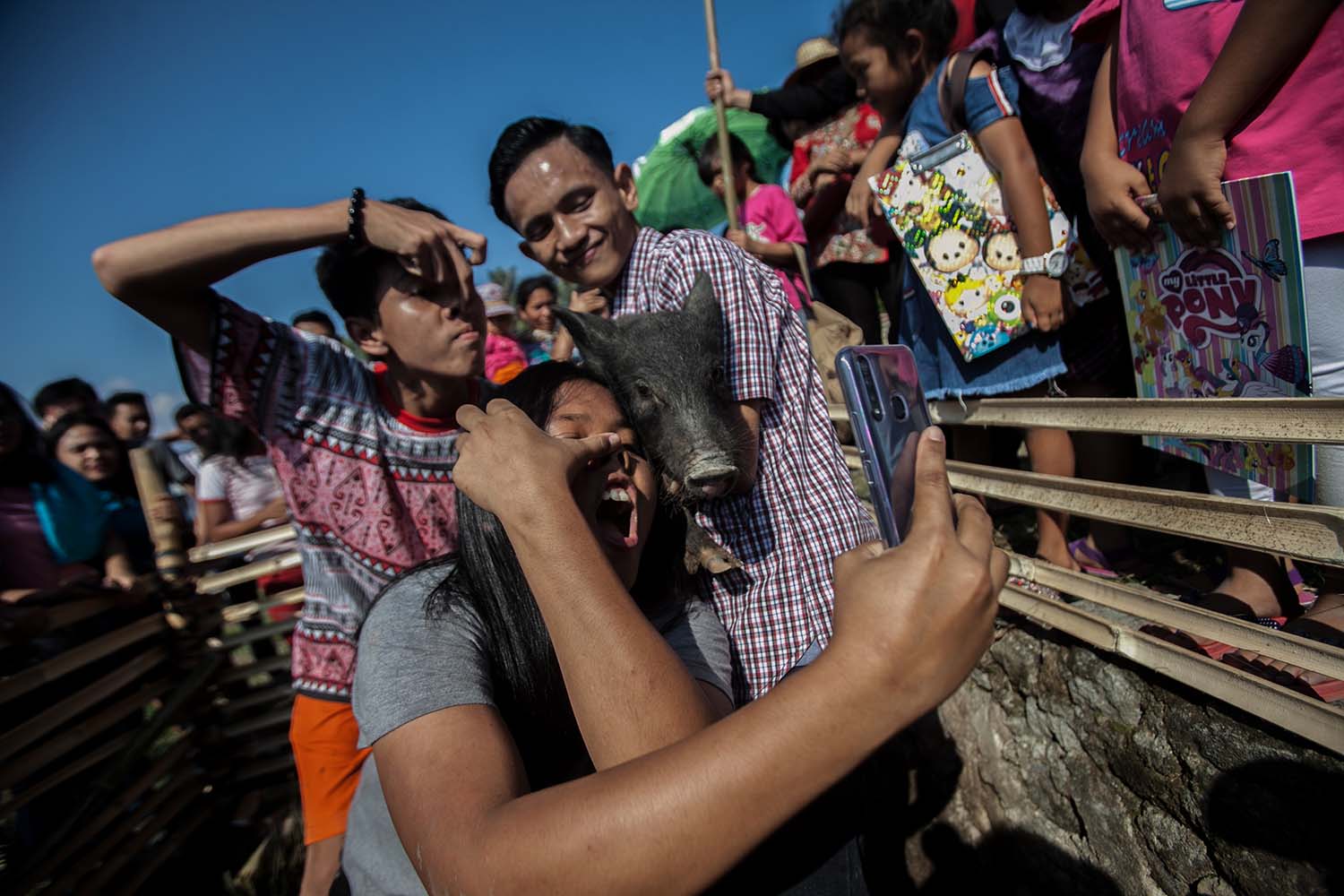 Smile together: Contestants take selfies with pigs during the Lake Toba Pig and Pork Festival 2019. JP/Andri Ginting