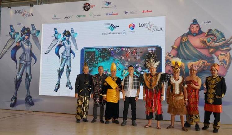 Garuda Indonesia director Ari Askhara (fourth right) and high-ranking officers of Anantarupa Studios introduce online video game character GIA from 
