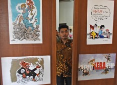 Anticorruption exhibit displays 'value of honesty' through cartoon caricatures