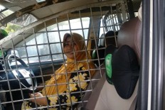 Female taxi&nbsp;driver installs security cage around driver's seat to protect against 'begal'