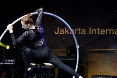 Carolin Liesegang from the Berlin School for Acrobatic Arts performs with a Cyr wheel on opening day of the Jakarta International Performing Arts (JakIPA) 2019, which ran Nov. 16-17 at Merdeka Square, Central Jakarta.