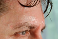 A man sweating.