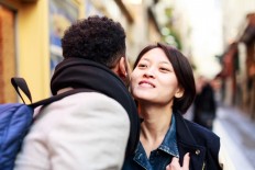 Missing kissing, Parisians say "la bise" is back