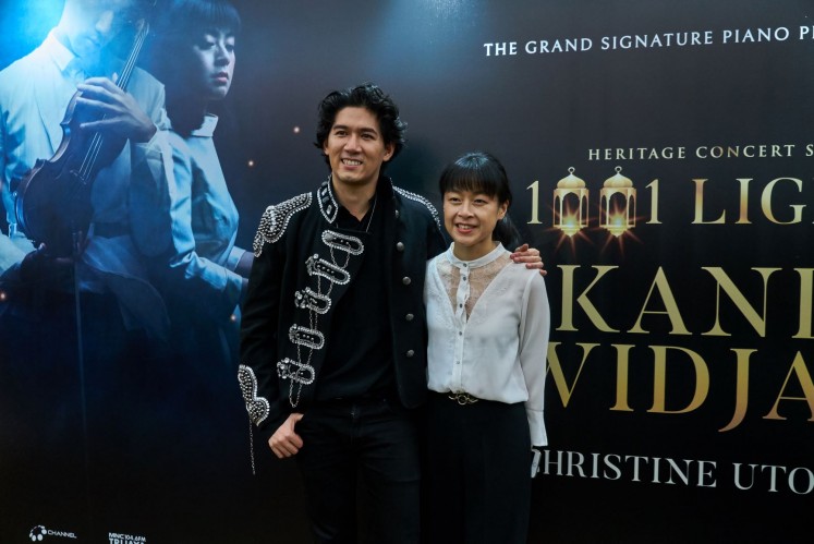 Coming home: Violinist Iskandar Widjaja and pianist Christine Utomo pose after the “Heritage Concert Series: 1001 Lights” in Soehanna Hall, SCBD, Central Jakarta. They have often appeared on stage together, but the latest concert was their first collaboration playing contemporary classical music.