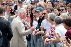 Britain's Prince Charles greets people during a visit to the Cathedral Square in Christchurch, New Zealand on Nov. 22, 2019.