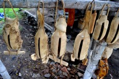 Different shapes of 'kentongan' created by craftsmen at Jambu Kulon village in Klaten regency, Central Java.
