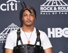 In this file photo taken on April 7, 2017, hip-hop artist T.I. poses at the 31st Annual Rock And Roll Hall of Fame Induction Ceremony at Barclays Center in New York City. 