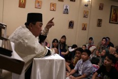 Servitude: Archimandrite Daniel Byantoro gives a sermon at the Janasuci Petrus & Paulus Church in Tangerang, Banten. JP/ Taufan Wijaya