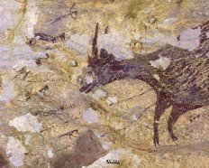 This handout photography released by Griffith University on December 11, 2019, shows cave art inside Bulu Sipong 4, Sulawesi, Indonesia. - A hunting scene painted 44,000 years ago, the oldest known to date, whose half-human, half-animal representations suggest a successful artistic culture, or even the beginnings of a religion, was discovered in a prehistoric cave in Indonesia, has been revealed in a study on December 11. 