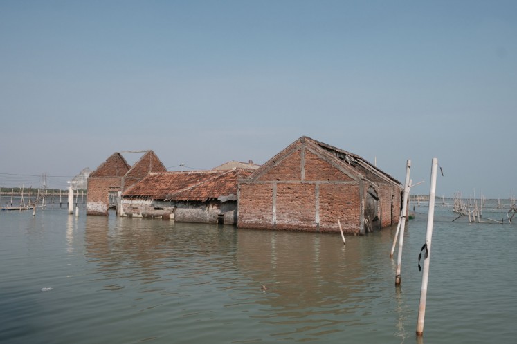 Sea waters inundate houses in Sriwulan village, Demak regency, Central Java, on Monday, Sept. 23. Houses in the area have been permanently inundated due to large-scale coastal erosion.