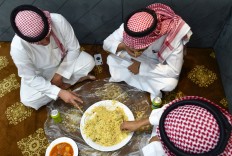 Saudi have lunch at a restaurant in the capital Riyadh on July 2, 2019. 