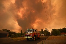 Thousands evacuated as wildfires hit Southeast Australia