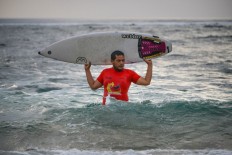 Survival surfing: Indonesians riding the waves to beat tsunami trauma
