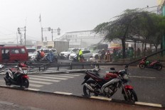 Motorcyclist dies after billboard collapses on him
