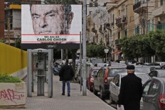 This file photo taken on December 6, 2018 shows a portrait of ousted Nissan chairman Carlos Ghosn on a publicity billboard in his support on a street in Beirut. Former Nissan chief Carlos Ghosn, who was on bail in Tokyo awaiting trial on financial misconduct charges, has arrived in Beirut, Lebanese official and security sources said late on December 30, 2019. Local Lebanese media reported that he had arrived by private plane from Turkey.
