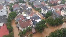 An aerial view shows the Kebun Jeruk Indah housing area in Srengseng, West Jakarta, which was flooded on Wednesday morning, the first day of 2020, after heavy rains hit the city since Tuesday. 