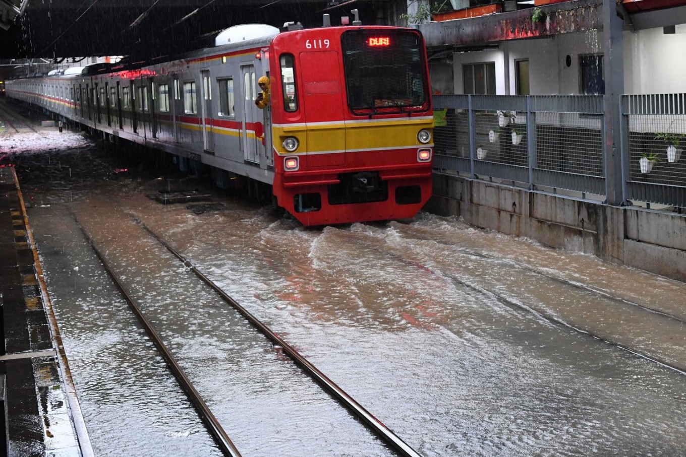 Railway tracks at Sudirman Station in Menteng, Central Jakarta are inundated by water on Wednesday morning.