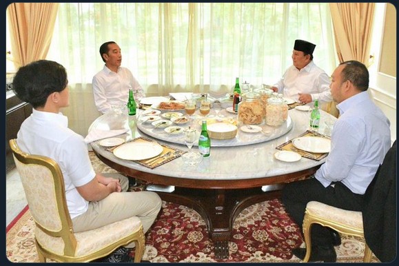 President Joko "Jokowi" Widodo, accompanied by his youngest son, Kaesang Pangarep, receives Defense Minister and former rival Prabowo Subianto, who arrived with his son, Didit Hediprasetyo, in this stock photo taken in Surakarta, Central Java, on New Year's Day in 2020.
