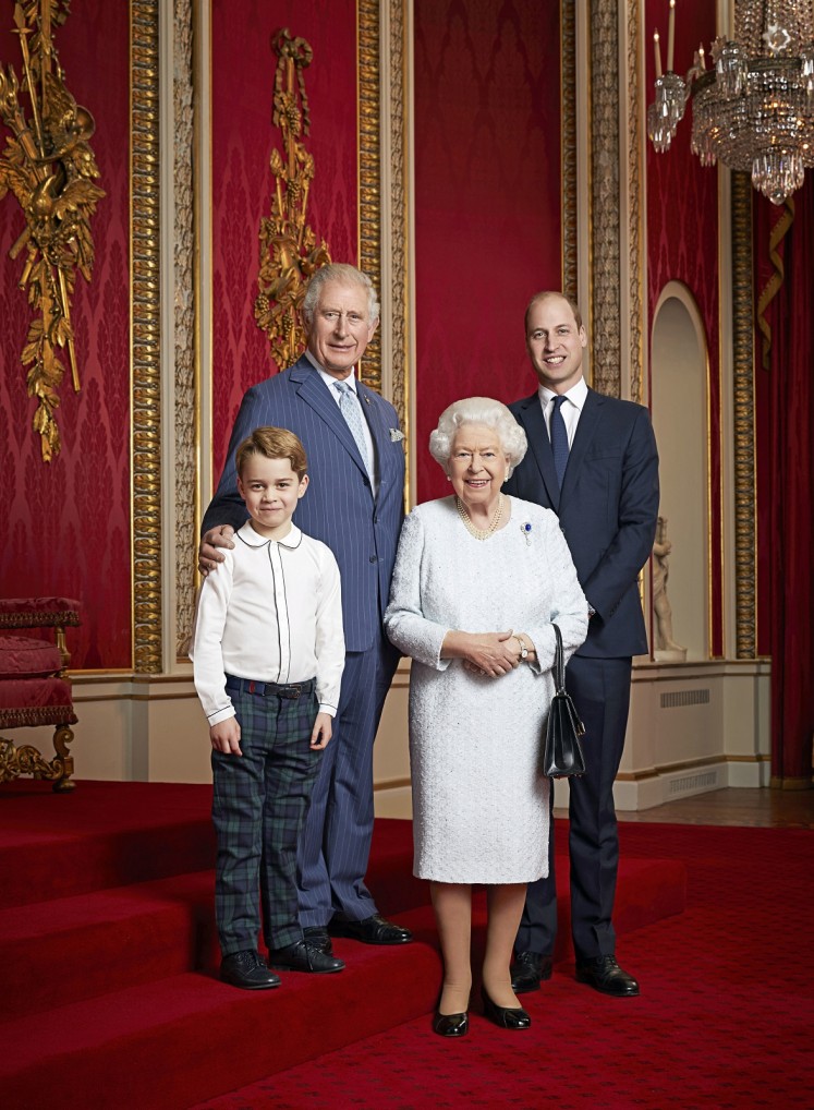 Britain's Queen Elizabeth II, Prince Charles, Prince William Prince George pose for a portrait to mark the start of a new decade, in the Throne Room at Buckingham Palace in London, Britain December 18, 2019. 