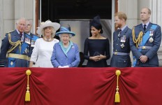 In this file photo taken on July 10, 2018 (L-R) Britain's Prince Charles, Prince of Wales, Britain's Camilla, Duchess of Cornwall, Britain's Queen Elizabeth II, Britain's Meghan, Duchess of Sussex, Britain's Prince Harry, Duke of Sussex and Britain's Prince William, Duke of Cambridge stand on the balcony of Buckingham Palace on July 10, 2018 to watch a military fly-past to mark the centenary of the Royal Air Force (RAF). 