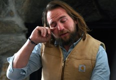 'Evryman' Co-Founders Lucas Krump cries during a group meeting at Race Brook Lodge on December 6, 2019 in Sheffield, Massachusetts. 