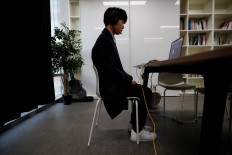 'Smile with your eyes': How to beat South Korea's AI hiring bots and land a job