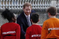 Prince Harry resurfaces but stays silent on royal rumpus