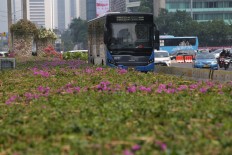 A Transjakarta bus passes through the Jl. MH Thamrin in Central Jakarta Aug. 19, 2019.