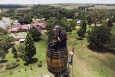 Suspended in a barrel, South African man set to break 'pole sitting' record