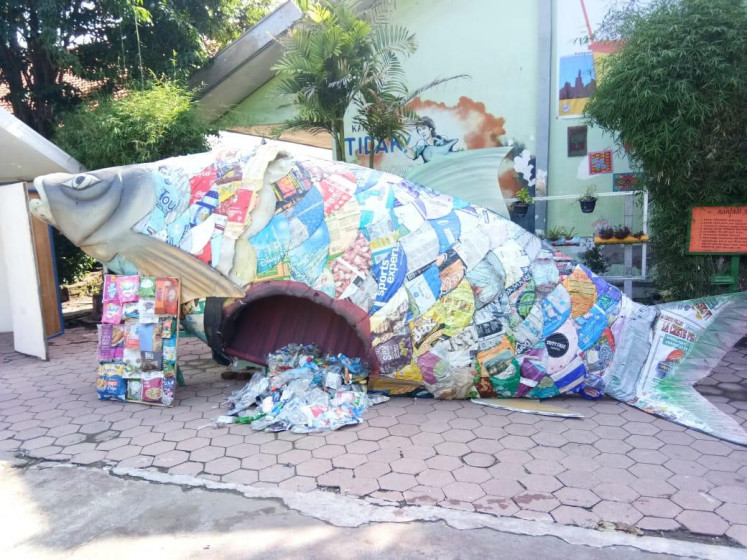A giant fish made of plastic trash is part of an environmental exhibition in state junior high school SMP 12 in Gresik, East Java on Jan. 18.