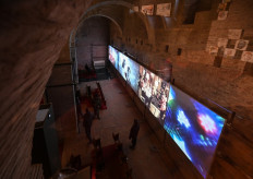 Visitors view film footage displayed at the exhibition 'Fellini 100 : Immortal Genius' celebrating late Italian filmmaker Federico Fellini in Castel Sismondo on January 20, 2020 in Rimini, northeastern Italy, honoring the filmmaker's memory through a major exhibition of film footage, photographs, archive documents, sets, props and costumes of many of his movies. 