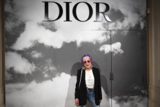US artist Judy Chicago poses prior to the start of the Christian Dior Women's Fall-Winter 2019/2020 Haute Couture collection fashion show in Paris on July 1, 2019. 