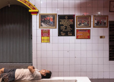 A temple caretaker sleeps during a break from work. JP/Bismo Agung