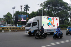 A mobile LCD unit runs across the Sudirman area, Jakarta, on January 27, 2020. 