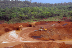 Work is carried out at a mining site of PT Vale Indonesia in Sorowako, South Sulawesi, in this undated photo, with restored forest seen in the background. The company reported an almost 20 percent year-on-year decline in output in the second quarter of 2021.