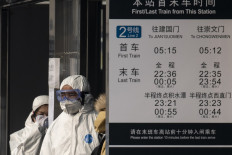 China urges citizens to delay foreign travel over virus fears