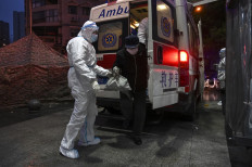 Local heroes: Wuhan motorists defy virus threat to help neighbors